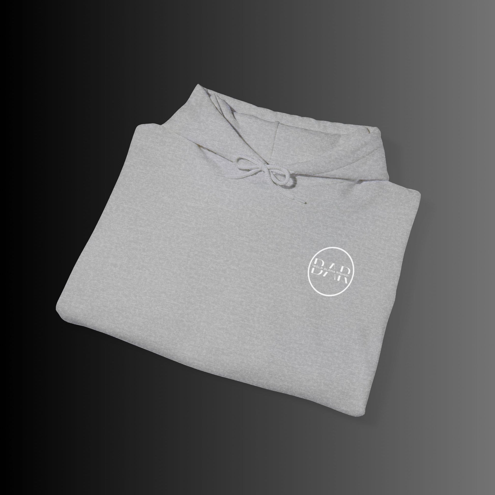 Bold Alpha Rising presents a sleek light grey hoodie featuring the iconic Bold Alpha Rising (BAR) logo elegantly placed on the left chest. The minimalist yet powerful design represents strength, ambition, and resilience, making it a bold statement piece. The light grey fabric provides a striking contrast, allowing the logo to stand out while maintaining a clean and modern aesthetic. Perfect for those who embody the mindset of growth and perseverance.