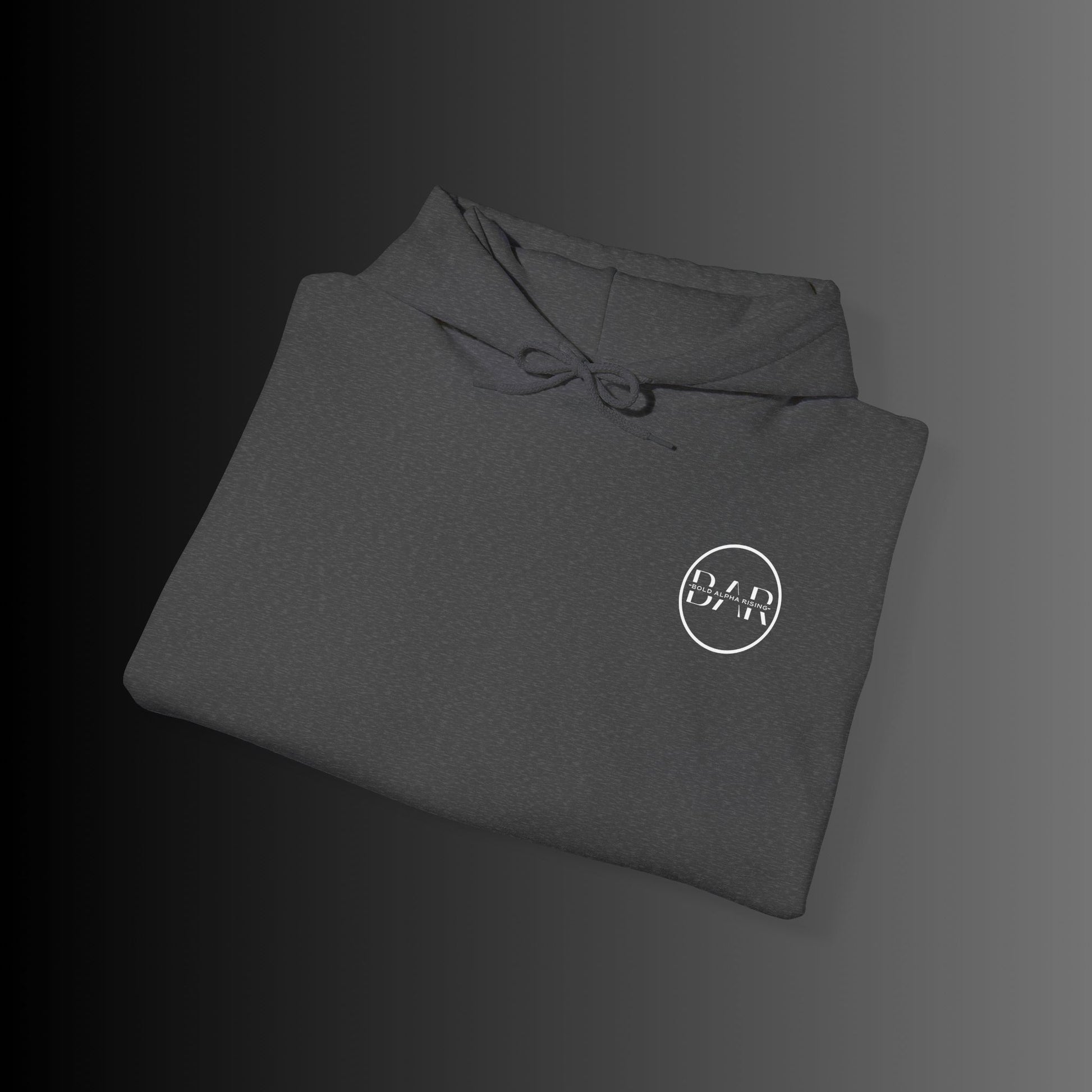 Bold Alpha Rising presents a sleek deep grey hoodie featuring the iconic Bold Alpha Rising (BAR) logo elegantly placed on the left chest. The minimalist yet powerful design represents strength, ambition, and resilience, making it a bold statement piece. The deep grey fabric provides a striking contrast, allowing the logo to stand out while maintaining a clean and modern aesthetic. Perfect for those who embody the mindset of growth and perseverance.