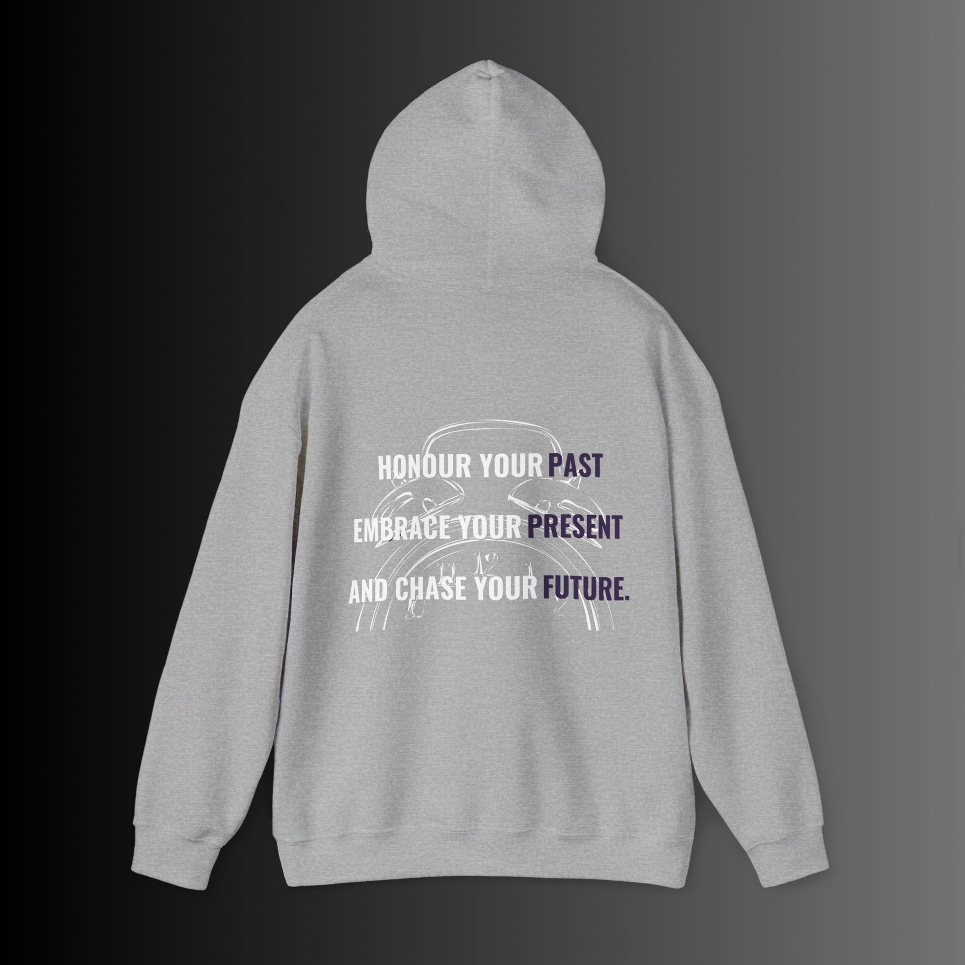 Bold Alpha Rising presents a sleek light grey hoodie featuring the inspiring quote: 'Honour your past, Embrace your present, and Chase your future.' The quote is creatively printed within a vintage two-bell alarm clock silhouette in crisp white, symbolizing the importance of time, reflection, and forward momentum. The contrast between the light grey fabric and the white design enhances visibility, making this hoodie a statement piece that embodies ambition, growth, and perseverance